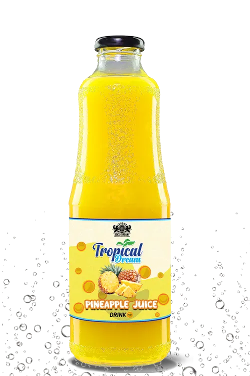 Tropical Dream Pineapple Juice Drink by London Juice Company in a tall clear glass bottle with a black cap.
